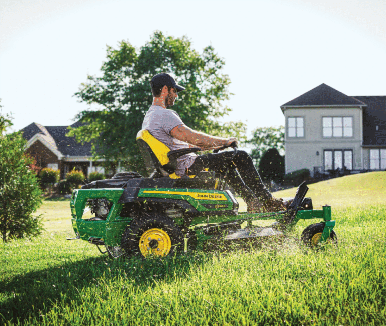 John Deere Z320R ZTrak™ Mower with 42″ Deck pictured being ridden to mow a large lawn