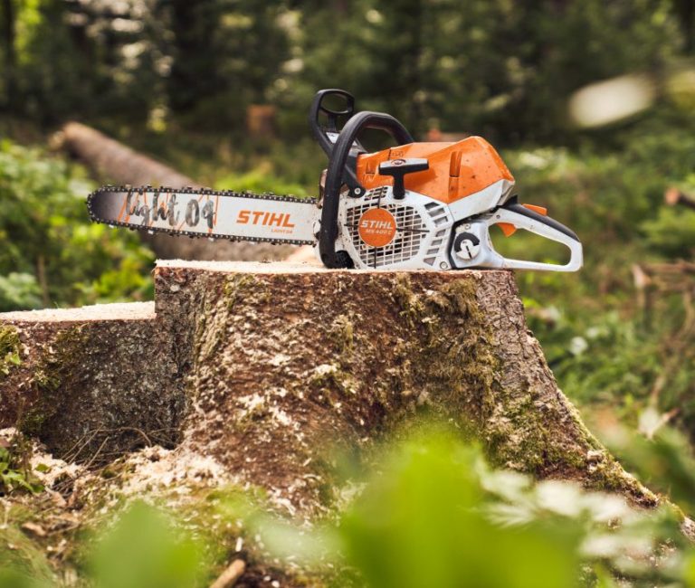 stihl chainsaw being displayed on a log